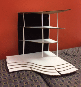 Photo showing Karen's structure, a three-tiered structure made of cardboard, felt, and plastic rods.